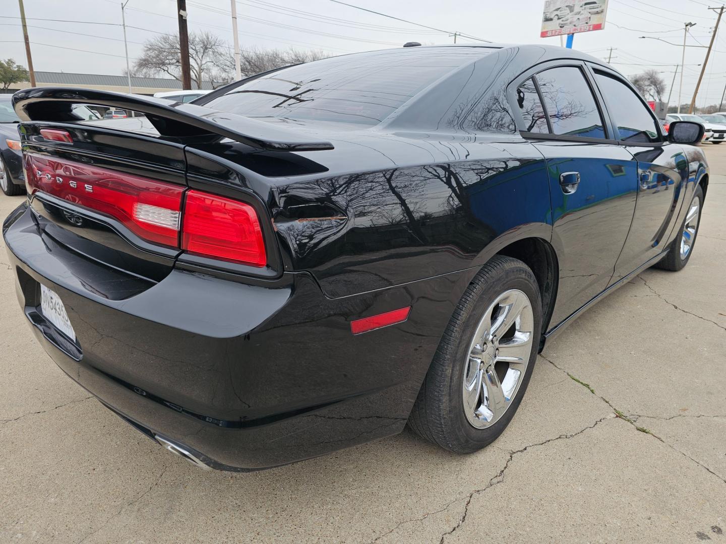 2014 Black Dodge Charger SE (2C3CDXBG6EH) with an 3.6L V6 DOHC 24V engine, 5-Speed Automatic transmission, located at 2020 East Division Street, Arlington, TX, 76011, (817) 801-3191, 32.742390, -97.076874 - Premiere Buy Here Pay Here with NO Credit Check (score) at 2020 East Division Street, Arlington, Texas, located in the center of the Dallas/Fort Worth metro area. For in-house financing in Lancaster, Waxahachie, Cleburne, Sherman, Denton, McKinney, Waco, Weatherford, Grand Prairie to Plano (along wi - Photo#3